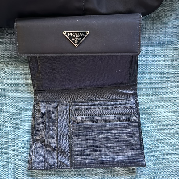 This is a black Prada crossbody with matching wallet. - Picture 7 of 8